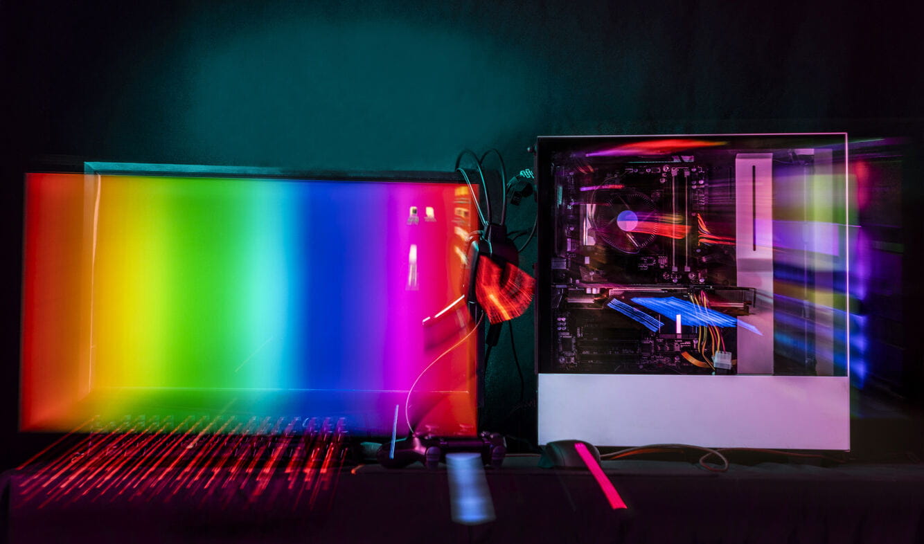 Imagem tecnológica de cores saindo de dentro da tela no computador